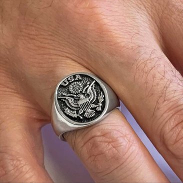 silver eagle ring on finger